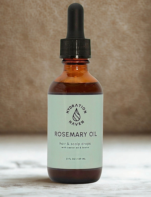 Glass dropper bottle of Rosemary hair growth oil for natural hair care